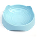 Blue ceramic dog slow feeder bowl with raised internal maze pattern for portion control