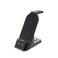 Black multifunctional wireless charging alarm clock with spots for phone, Apple Watch, and earphones.