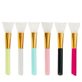 Reusable silicone face and body mask applicator brush in six colour options on a white background.