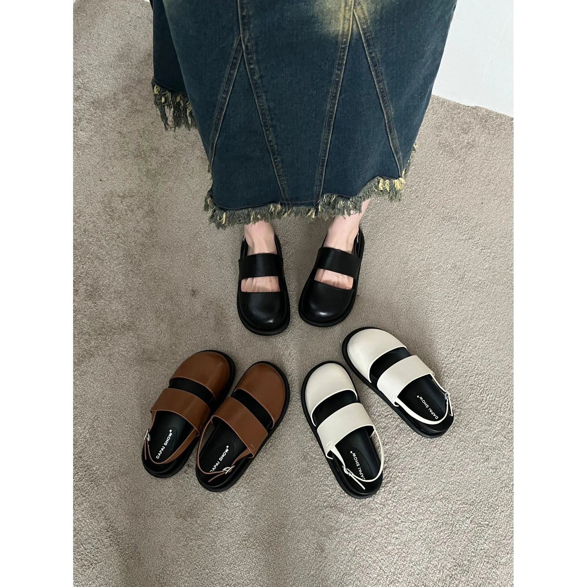 Retro women's sandals with a closed toe, ankle strap buckle, and platform sole in apricot colour.