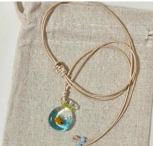 Women's joker charm pendant necklace in coloured glaze on a cotton and linen clavicle chain.