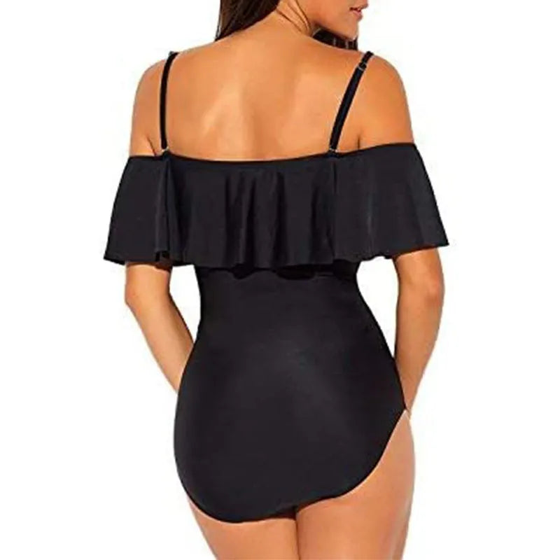 Black one-piece swimsuit with cut-out ruffled straps on a tube top