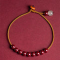 Hand-woven natural cinnabar bracelet with simple geometry shape on light background