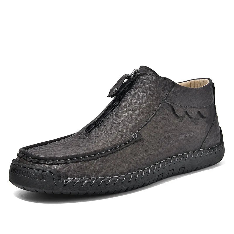 Men's black PU leather slip-on loafers with a round toe and sewn rubber sole on a white background.