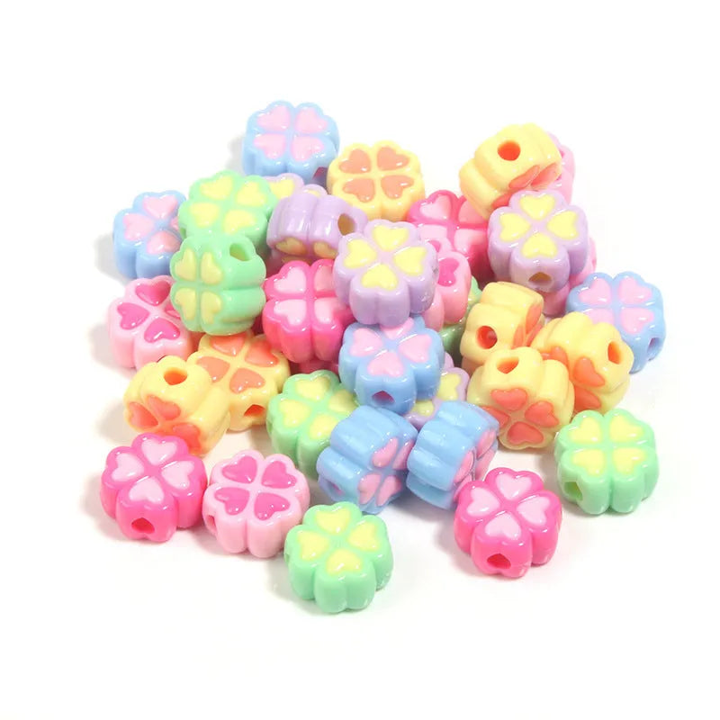 Assortment of 15mm frosted acrylic four-leaf clover beads in pink, yellow, green, blue, purple, and rose red.