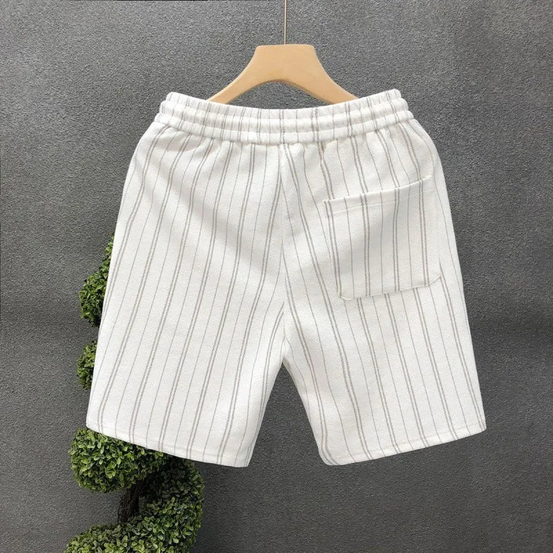 Men's black and white striped fleece-lined shorts with elastic waistband