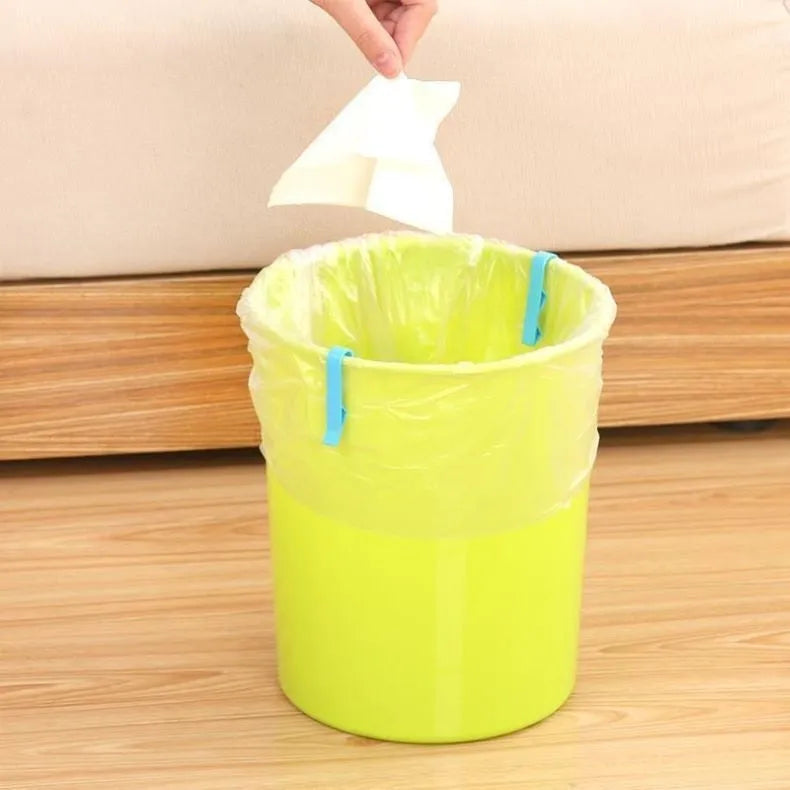 PP plastic bin bag fixing clip attached to a rubbish bin rim holding a liner in place.