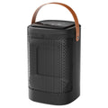 Tall black digital electric radiator heater with touch screen display and remote control on a wooden floor.