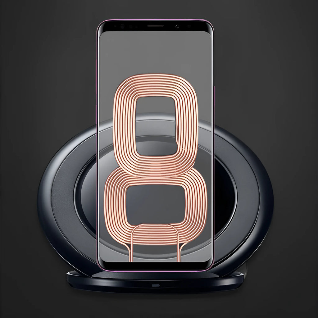 Black Qi wireless fast charging pad for Samsung Galaxy Note Edge on a desk next to a USB cable.