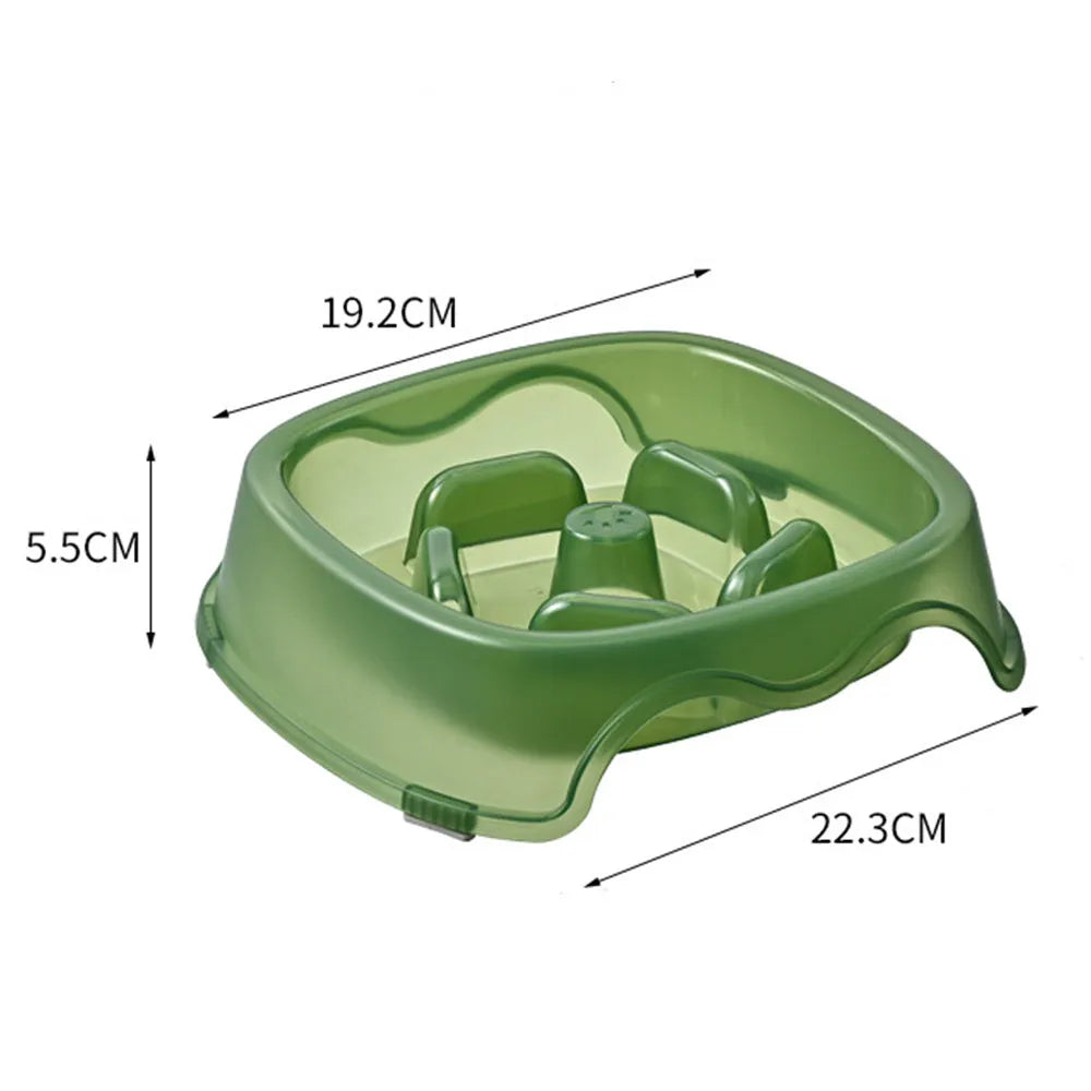 Blue plastic slow-feeder dog bowl on a wooden floor.