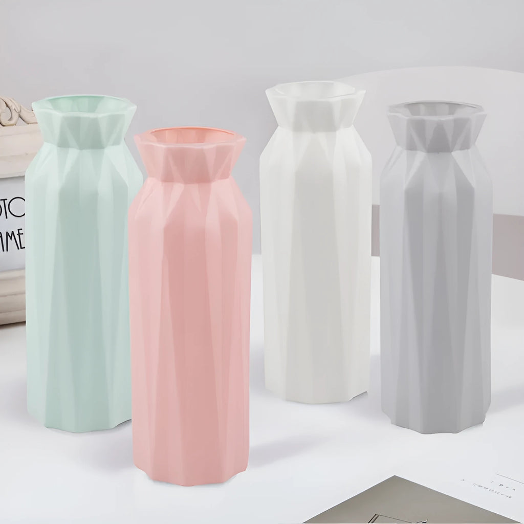 Grey melamine plastic vase with a wide 7.2cm base on a wooden table.
