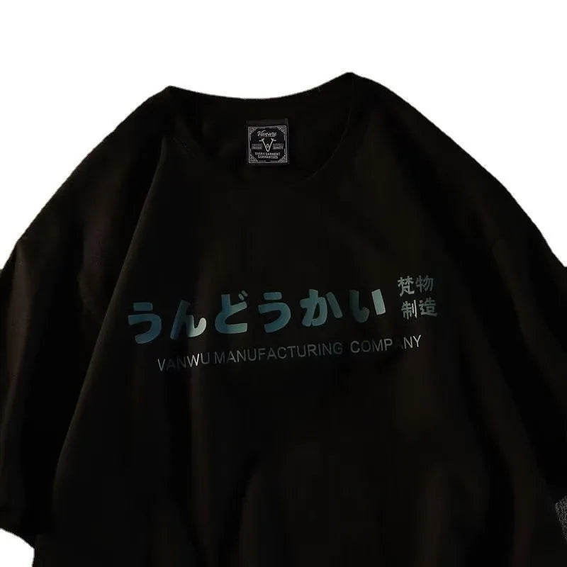 Loose fitting cotton t-shirt with short sleeves in black colour featuring printed letters design