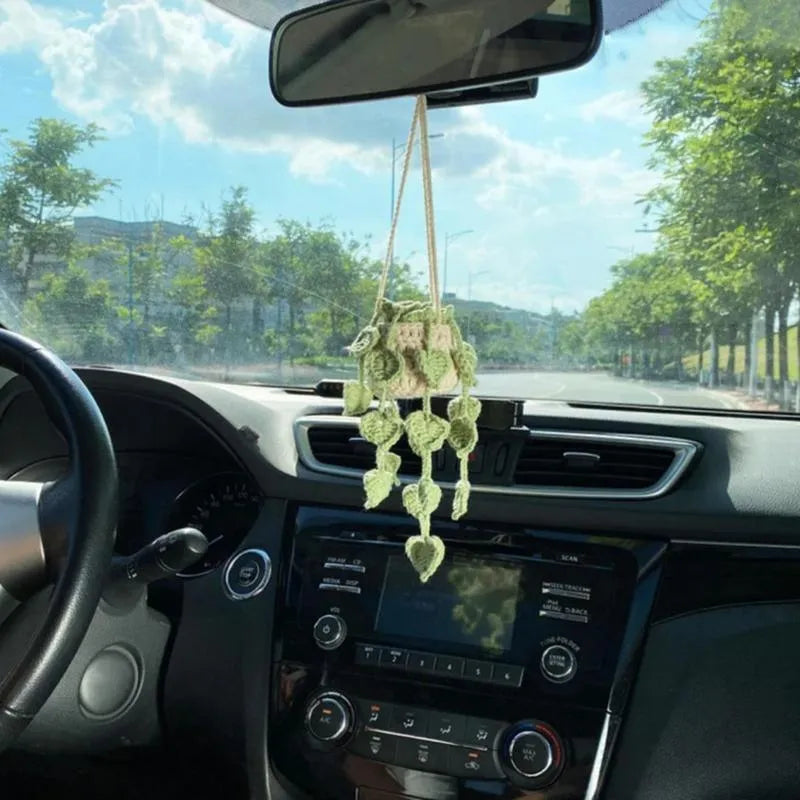 Green and white knitted wool car plant ornament with 25cm hanging rope on 8cm circular base
