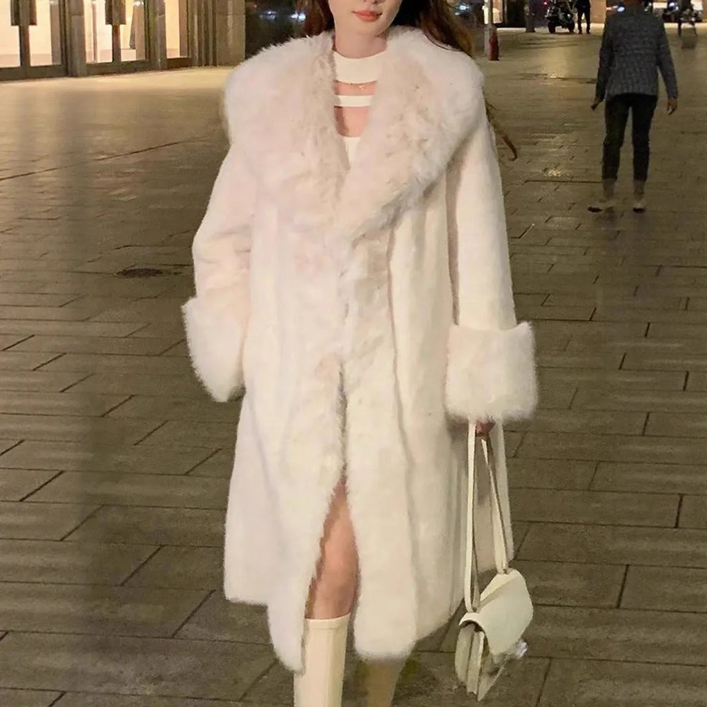 Grey women's mid-length faux fur coat with a thick plush texture and matching fur collar.