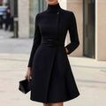 Women's long sleeve casual dress with stand collar and high waist in black, bohemian style on a model