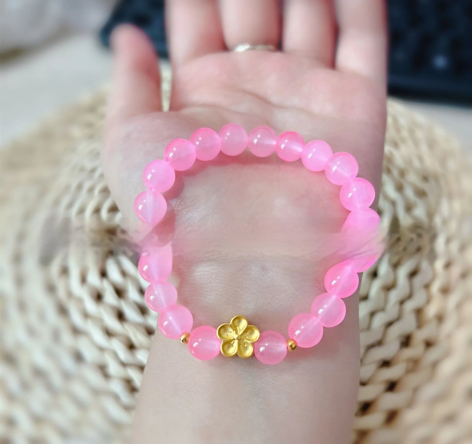 Women's aquamarine crystal bracelet with round geometric beads in mixed materials including natural pink crystal and imitation pearl
