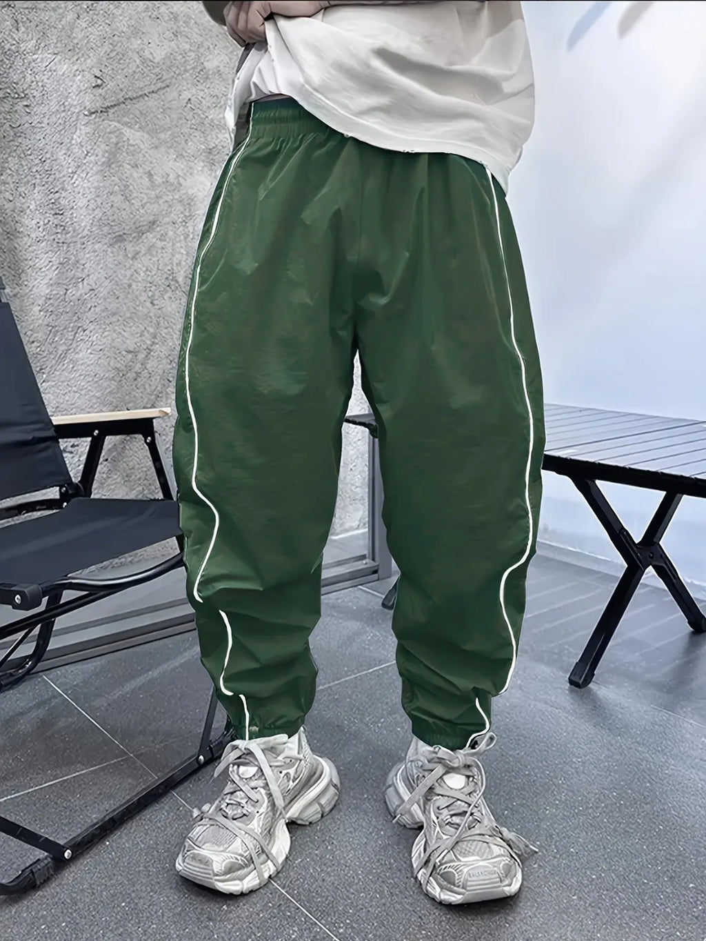 Men's loose-fit cropped casual trousers in bamboo fibre, shown in Army Green colour.