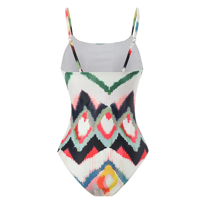Women's striped two-piece swimsuit set with matching hip skirt on a mannequin.