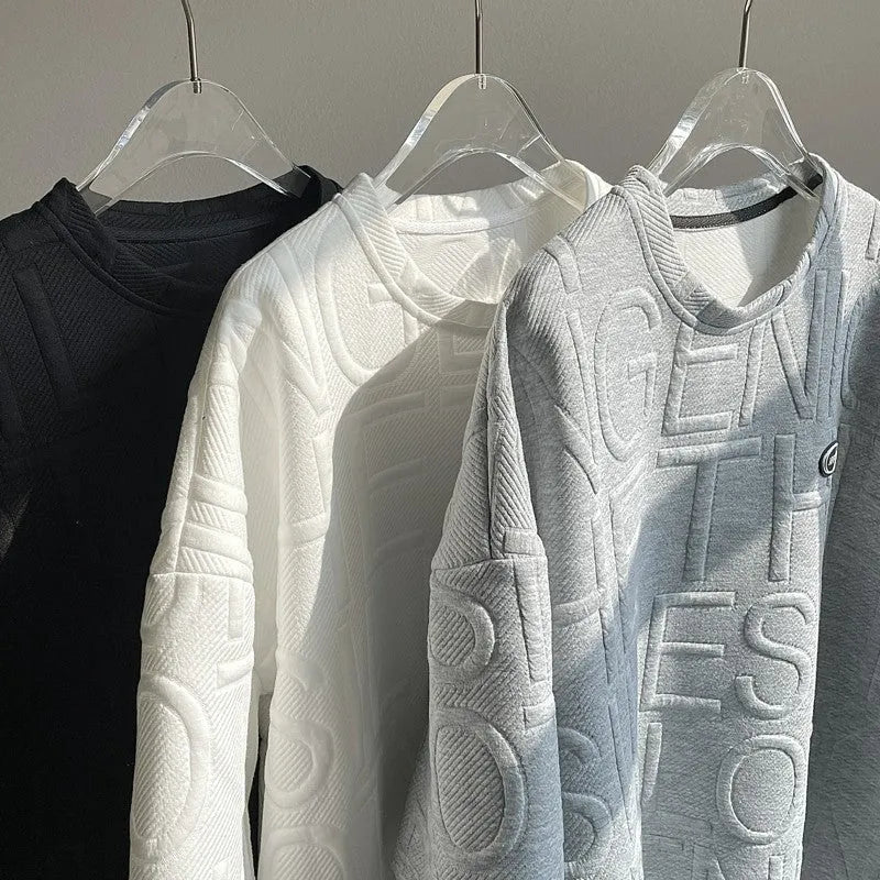 Men's grey loose-fit t-shirt with a raised 3D letter print on the front.