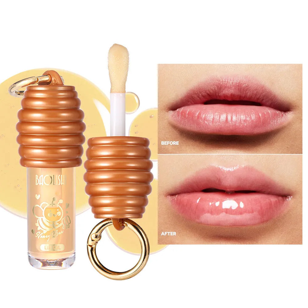 Honey Lip Gloss with keychain attached, showing portable design for bags and paniers