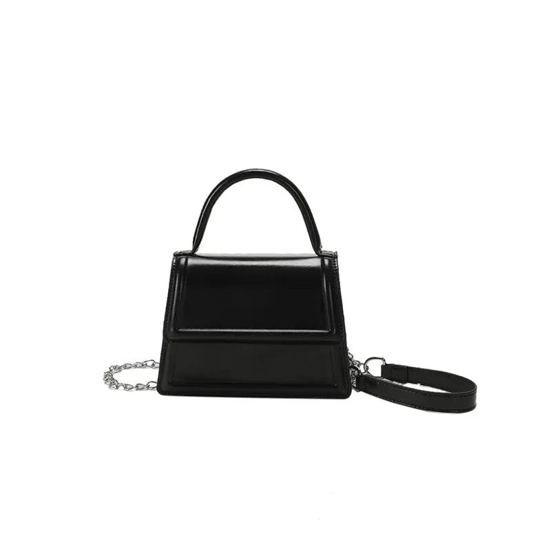 Retro square crossbody bag in PU material showing sewing line detail and crossbody strap