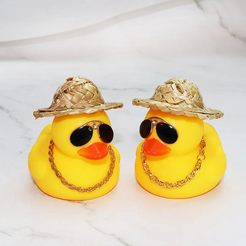 Straw hat yellow duck cartoon car dashboard ornament with adhesive gel and sunglasses necklace.