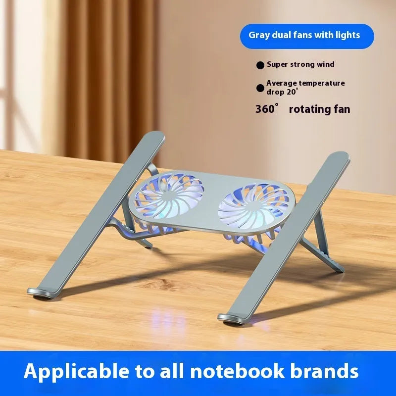 Silver aluminium laptop stand with twin cooling fans in folded position beside notebook computer