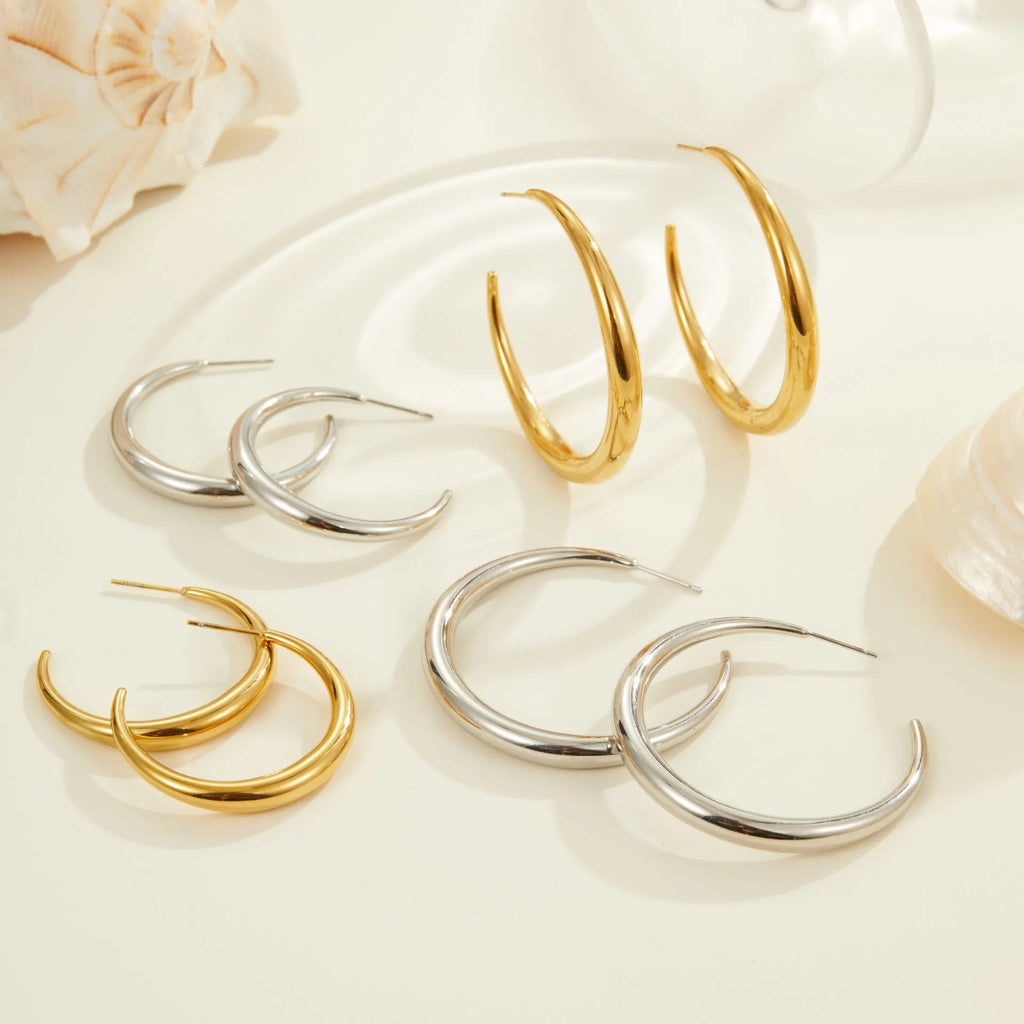 Geometric round titanium steel hoop earrings with 18K gold plating in large and small sizes