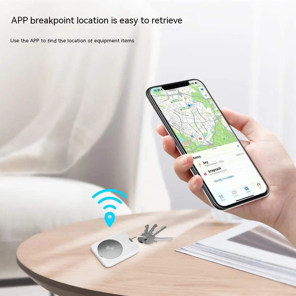 White ABS anti-lost locator pet tracking device for Apple users with alarm function on blue background