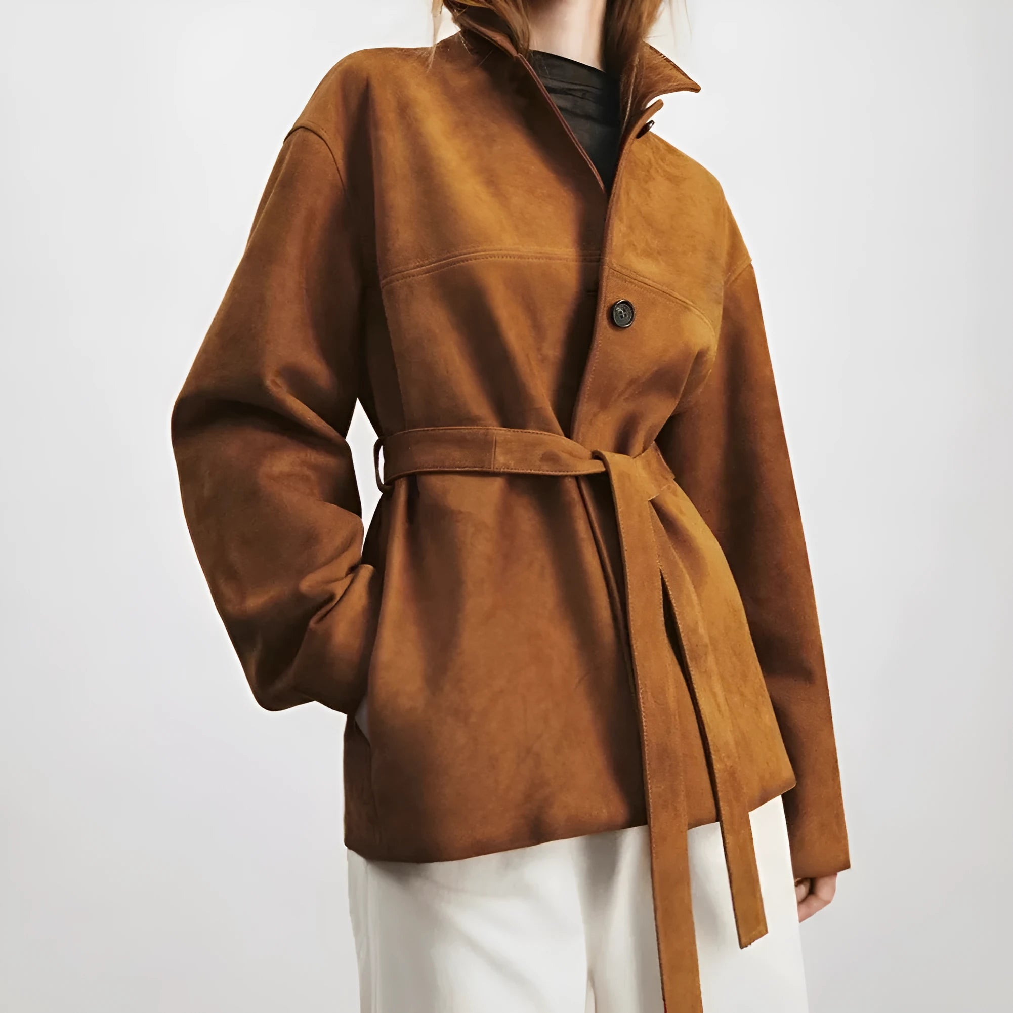 Women's loose-fit caramel mocha cashmere coat with a Peter Pan collar belt and leather stitching.