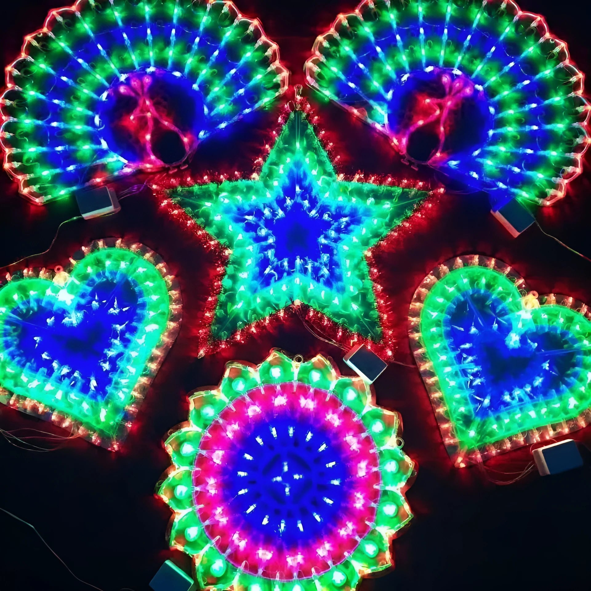 Outdoor Christmas festival string lights with peacock, love heart, sunflower, and star shapes displayed in festive decoration