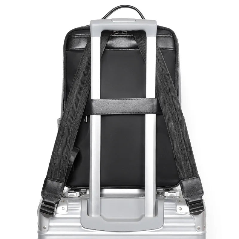 Men's black genuine leather computer backpack with woven detailing and physiological curve back plate