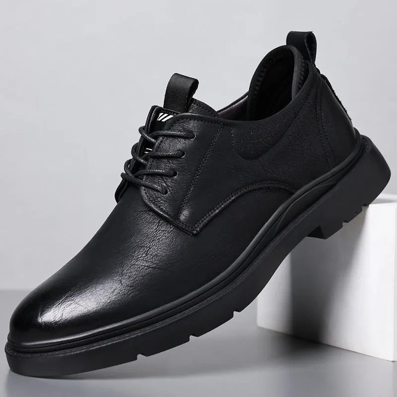 Men's black and brown leather casual sneakers with rubber sole and sewing line detailing