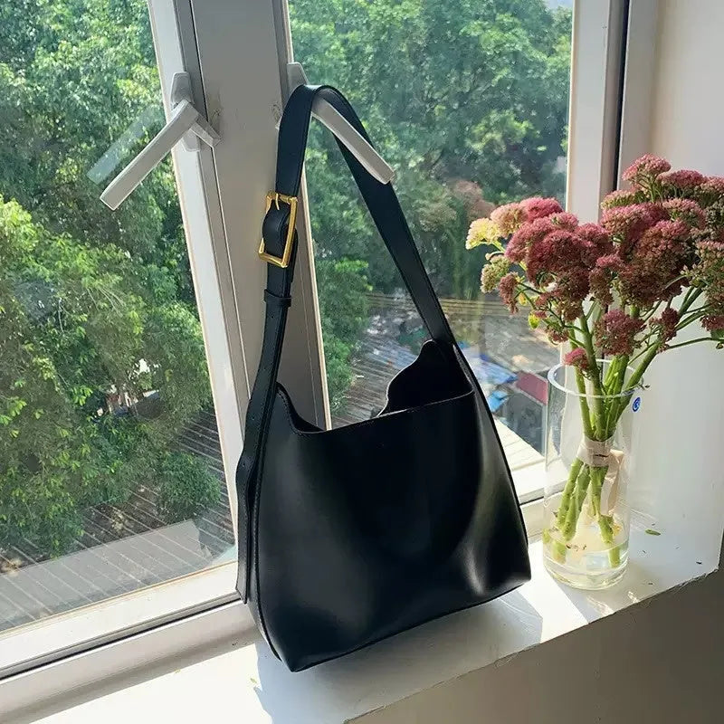 Pair of soft black and brown women's PU shoulder bags with decorative ribbons and swing threads.