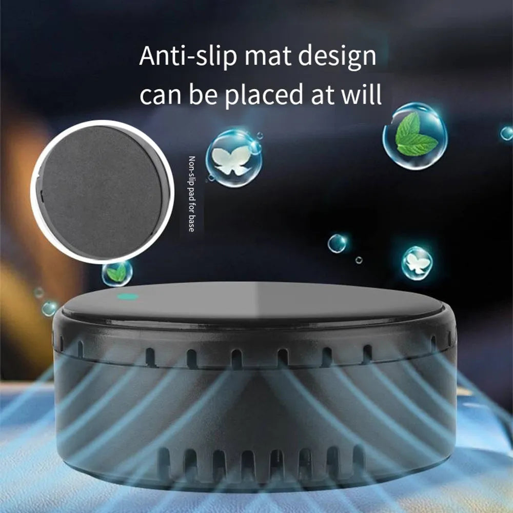 Black solar-powered car air humidifier mounted on a vehicle's air conditioning vent.