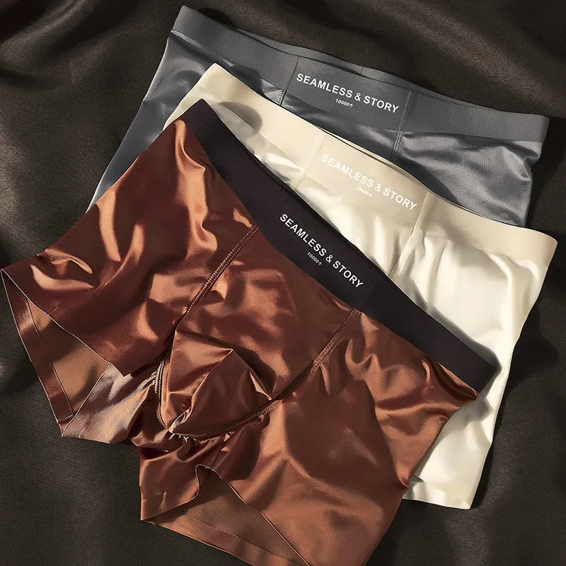 Men's Ice Silk satin-finish underwear in mid waist style, showing solid colour options including coffee, light grey, white, and blue.