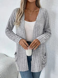 Men's solid colour long sleeve cardigan with front pockets in loose fit polyester knitwear