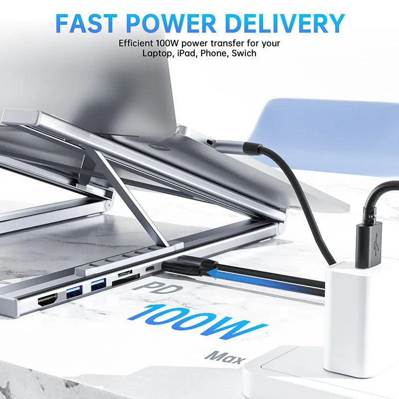 Silver aluminum alloy folding laptop stand with 8-in-1 HDMI docking station ports visible
