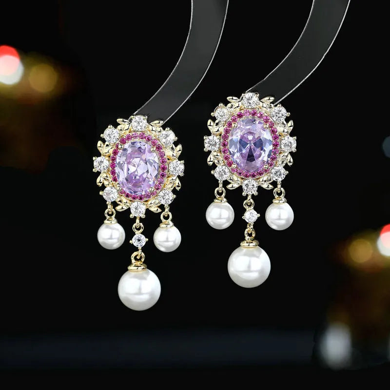 Oval geometric copper earrings with inlaid zircon centre and white pearl tassel drop in light purple colour.