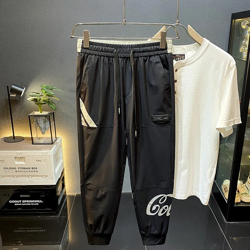 Man wearing black ultra-thin ice silk cotton ankle-banded cropped casual trousers