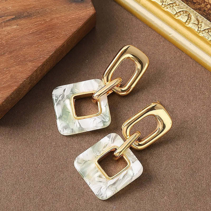 Hollow geometric square earrings in copper with electroplated finish and chamfered corners