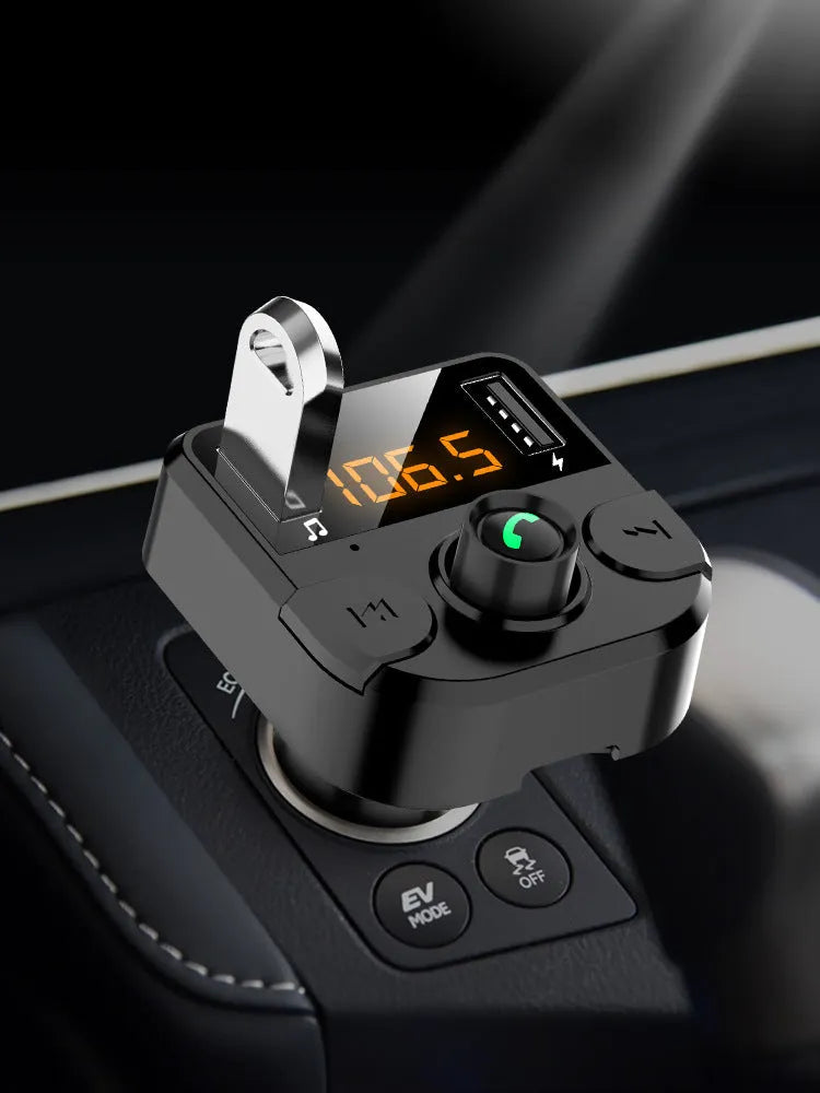 Black BT36B car MP3 Bluetooth player with 1.1-inch screen plugged into a car cigarette lighter socket.