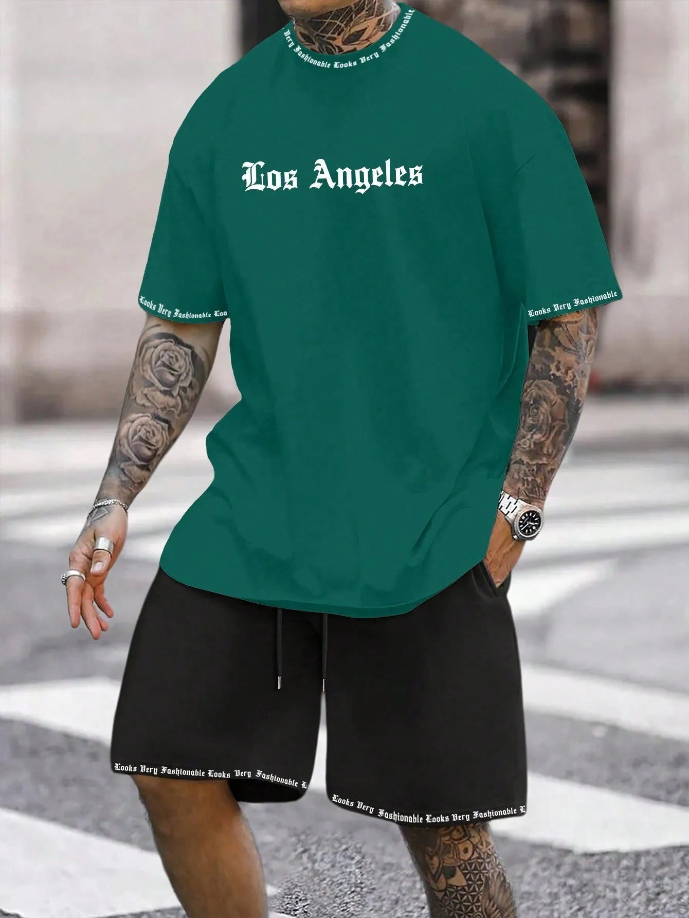 Men's navy blue printed short-sleeved top and matching shorts sports set on a white background