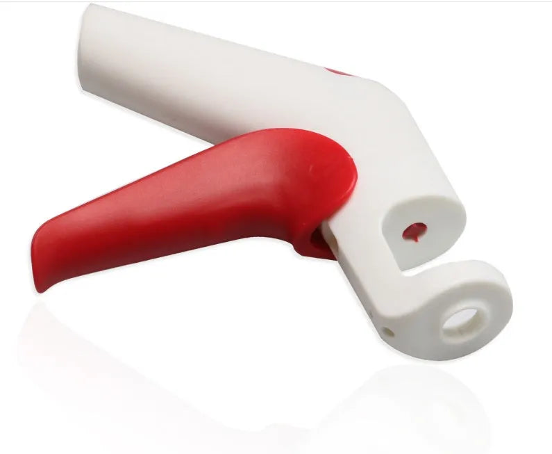 Cherry kernel remover creative kitchen gadget with comfortable handle on white background