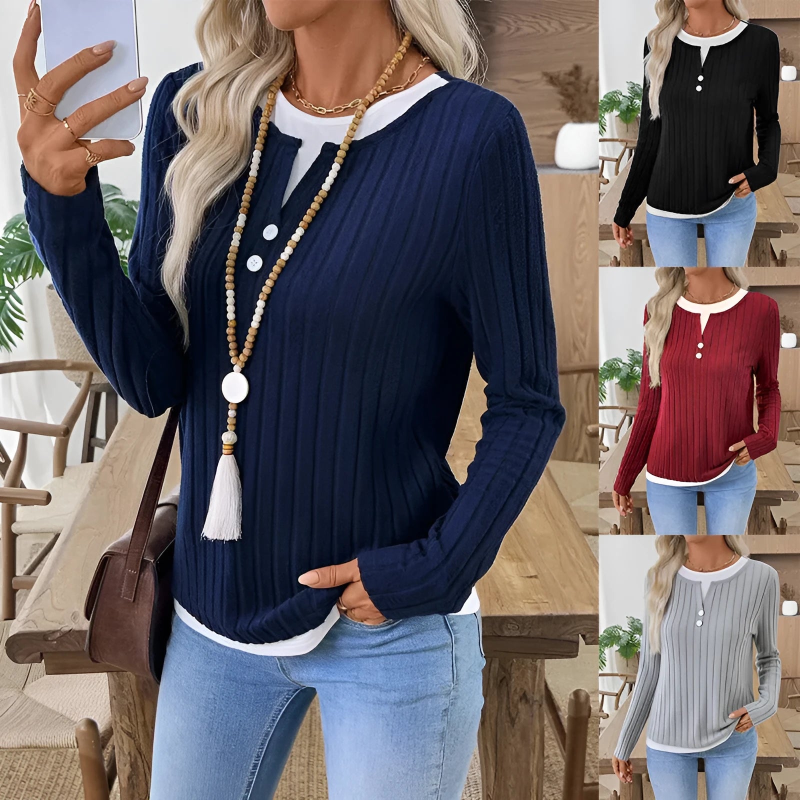 Women's black fake two-piece pullover sweater with a round neck and a button on the shoulder.