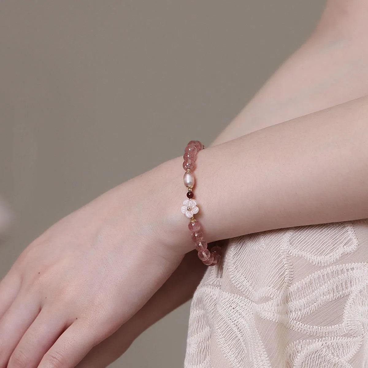 Strawberry quartz crystal bracelet with peach blossom flower charm and adjustable clasp