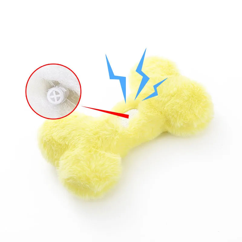 Blue plush love bone dog toy with squeaker for bite-resistant interactive play.