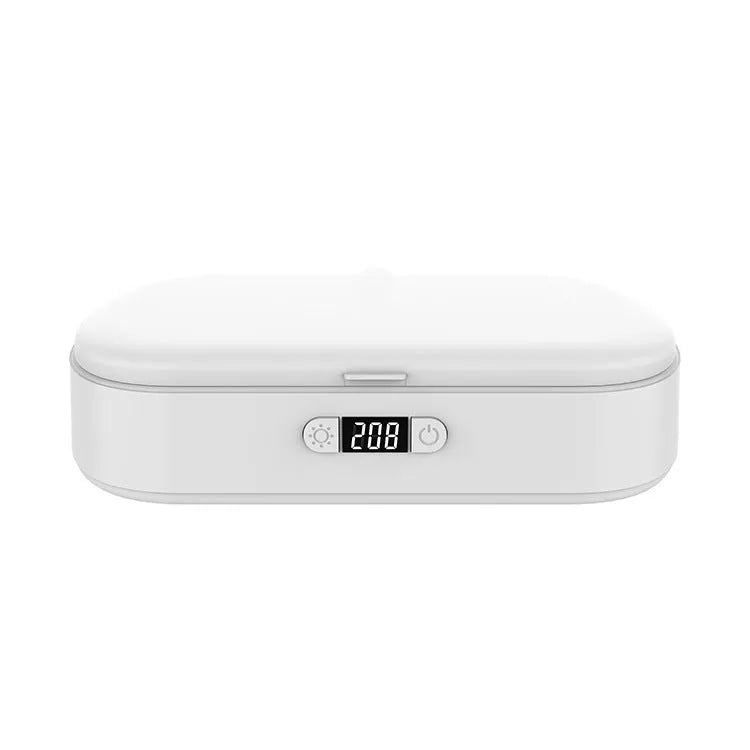White portable UV steriliser box with wireless charging for phones and toothbrushes