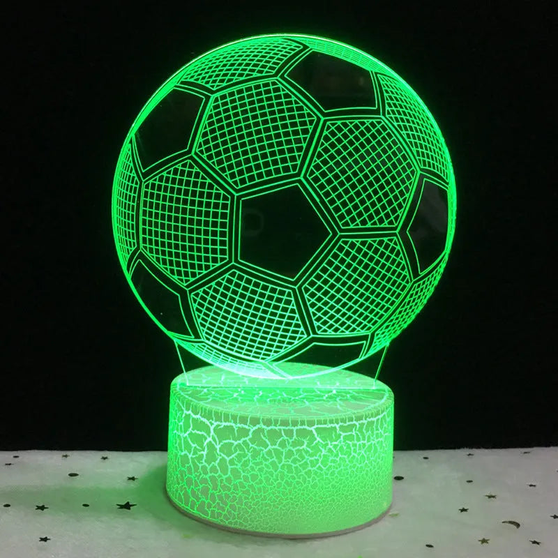 3D acrylic football night light on a square black base, showing multi-coloured LED illumination.