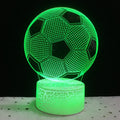 3D acrylic football night light on a square black base, showing multi-coloured LED illumination.